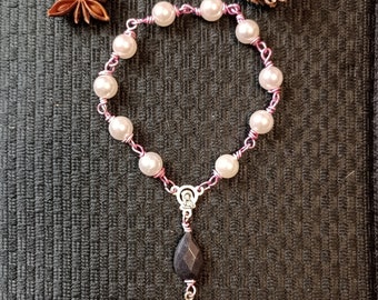 Pink rosary hand, black agate bead