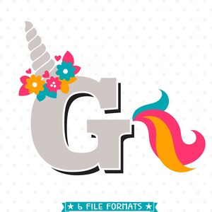 May include: A gray letter G with a unicorn horn, flowers, and a rainbow tail. The horn is white and the flowers are pink, yellow, and blue. The tail is pink, orange, and blue.