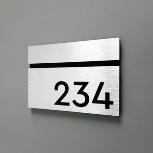 Brushed aluminum custom numbers. Silver hotel room numbers. Custom apartment number signs. Door numbers. Modern room number plaques.