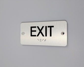 ADA compliant Exit sign with Grade 2 Braille and Tactile text. ADA Exit signs.