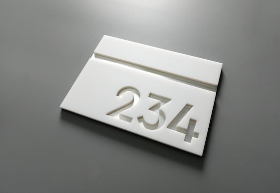 White room number signs. Apartment numbers. Hotel rooms. Exam rooms. Office door number signs. Custom number plaques. Modern address signs.