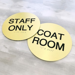 ADA compliant signs with custom text. Round custom quote ADA sign. Grade 2 Braille door signs. Room identification signs for businesses.
