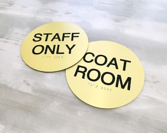 ADA compliant signs with custom text. Round custom quote ADA sign. Grade 2 Braille door signs. Room identification signs for businesses.