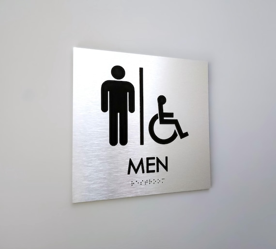 Accessible men restroom sign. Handicap accessible men's bathroom. ADA compliant bathroom signs. Tactile Braille signs.
