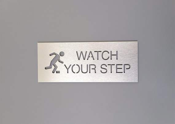 Watch your step sign. Caution watch your step. Caution sign with graphic. Safety business signage.