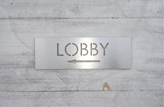 Lobby sign with arrow. Arrow signs. Directional lobby sign. Information signs for business. Wayfinding sign.