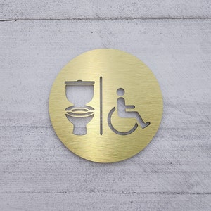 Restroom sign with toilet and handicap symbols. Handicap accessible bathroom signs. Restroom signage.