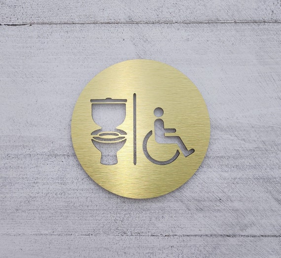 Restroom sign with toilet and handicap symbols. Handicap accessible bathroom signs. Restroom signage.