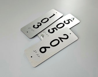 Custom vertical ADA room number signs. Tactile Grade 2 Braille door numbers. ADA compliant room numbers.