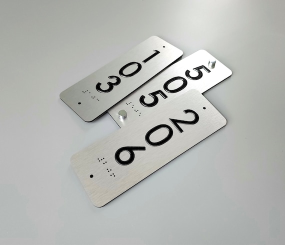 Custom vertical ADA room number signs. Tactile Grade 2 Braille door numbers. ADA compliant room numbers.