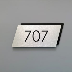 Modern apartment numbers. Metal room numbers. Door number plaque. Hotel room numbers.