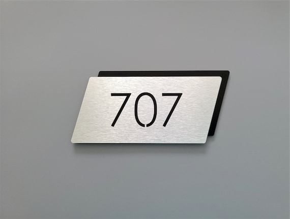 Modern apartment numbers. Metal room numbers. Door number plaque. Hotel room numbers.