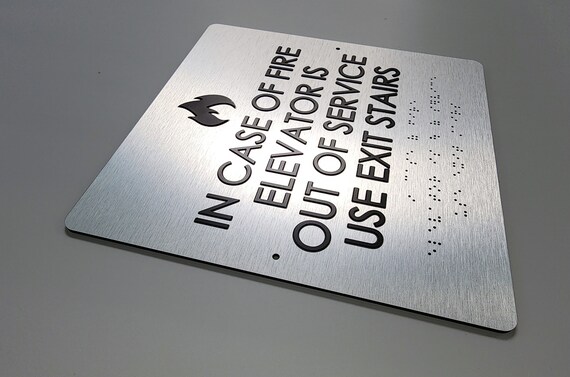 In case of fire use stairs ADA sign. Fire emergency signs. Elevator sign. ADA compliant building signs with Grade 2 Braille and raised text.
