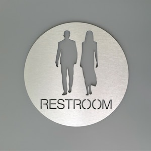 Modern male/female restroom sign. Bathroom sign. Silver. Gold. Unisex toilet. All gender restroom.