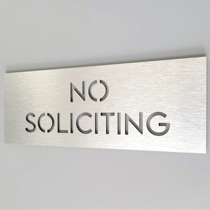 No soliciting sign. Front door sign. Do not knock or ring. Doorbell sign.