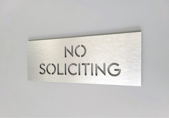 No soliciting sign. Front door sign. Do not knock or ring. Doorbell sign.