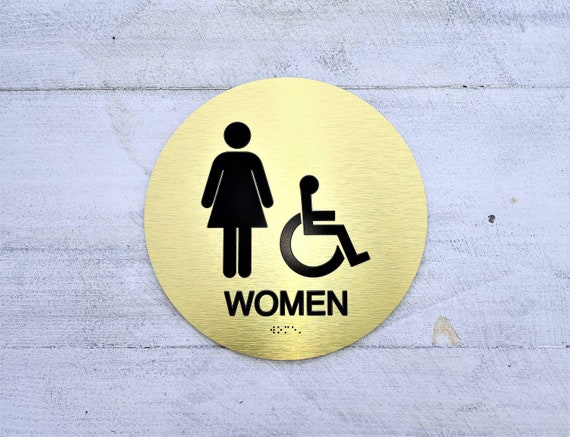 ADA Women restroom sign. Handicap accessible women's bathroom. ADA compliant bathroom signs. Tactile Braille signs.