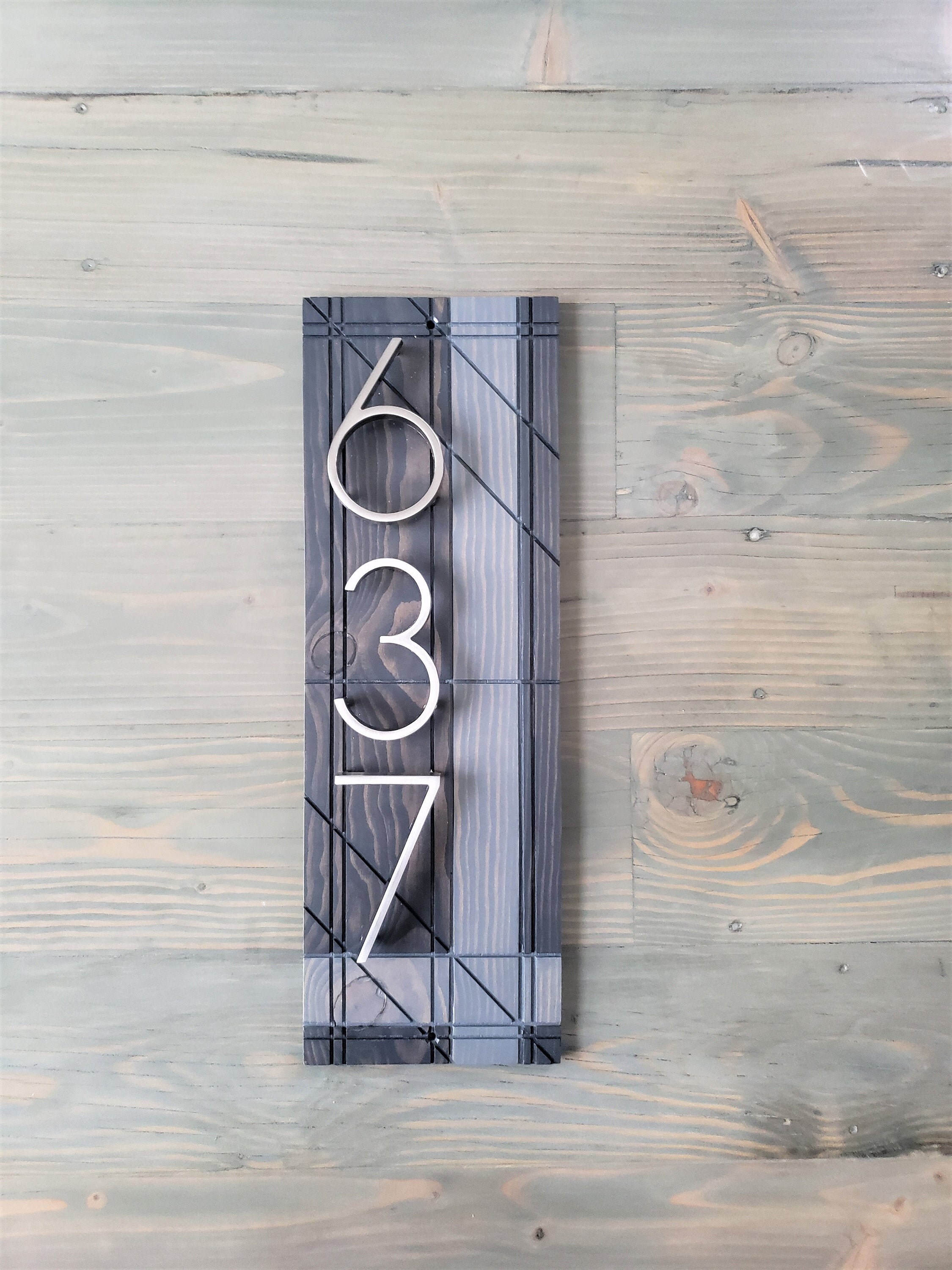 Vertical Gray House numbers plaque reserved for Valery Miranda Aquino