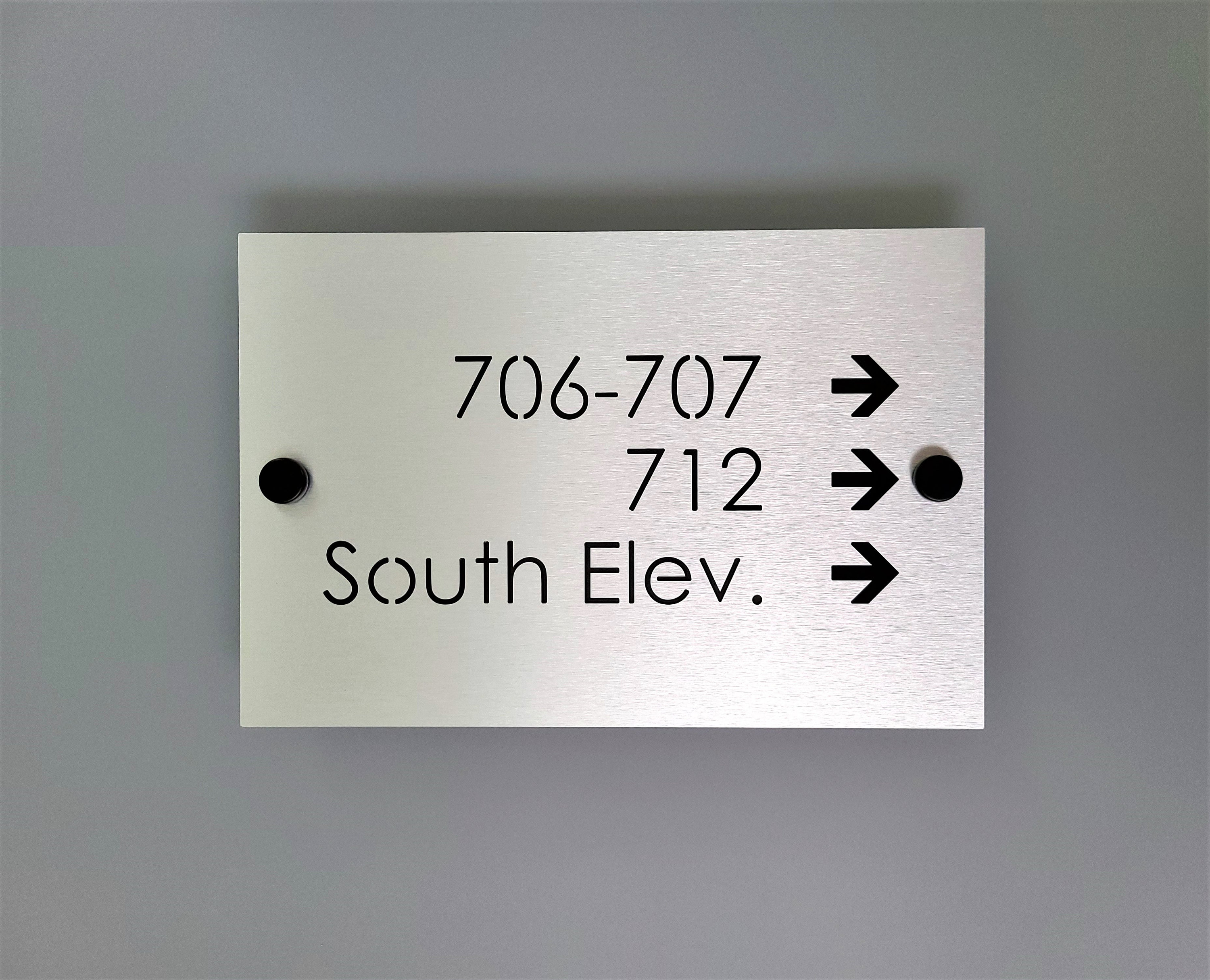 Custom directional sign. Hotel room directional signs. Wayfinding signs for business.