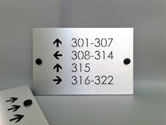 Custom directional sign. Hotel room directional signs. Wayfinding signs for business.