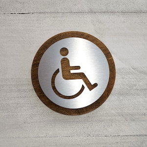 Wood and metal handicap door sign. Handicapped restroom sign. Bathroom. Toilet. Office. Restaurant. Hotel. Business.
