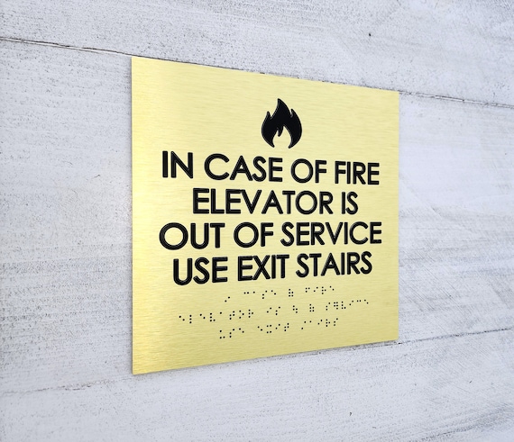 ADA in case of fire use stairs sign. Fire emergency signs. Elevator sign. ADA compliant building signs with Grade 2 Braille and raised text.