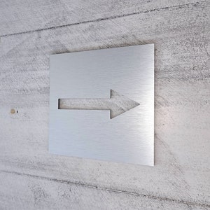 Arrow symbol sign. Directional arrow sign. Signs with arrow. Parking signs. Traffic direction sign.