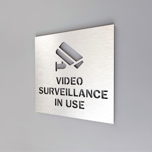 Video surveillance in use. Video security sign. Security camera sign. Surveillance camera signs.