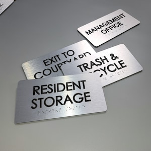 Custom text ADA door sign. ADA signs with raised text and Grade 2 Braille. Custom quote door signs. Room identification sign. Office sign.