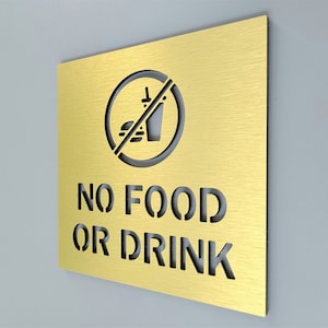 No food or drink sign for business. No food or drinks allowed sign. Informative signs. Notice sign.
