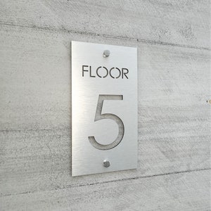 Floor numbers. Level numbers. Floor number signs. Stairway signs. Elevator sign. Stairwell signs. Building signage.