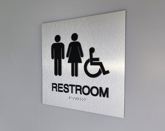 ADA compliant all gender restroom sign. Handicap accessible unisex bathroom. Wheelchair accessible restroom. ADA signs with Braille.