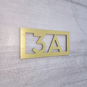 Custom door number plaque. Modern apartment numbers. Hotel room number signs. Bold door numbers. Silver. Gold. Black. White.