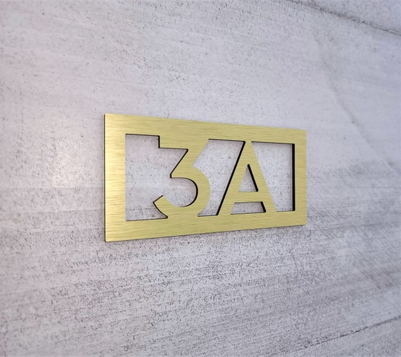 Custom door number plaque. Modern apartment numbers. Hotel room number signs. Bold door numbers. Silver. Gold. Black. White.