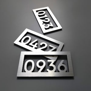 Custom apartment number signs. Modern apartment numbers. Hotel room door signs. Door number plaques. Silver. Gold. Black. White.