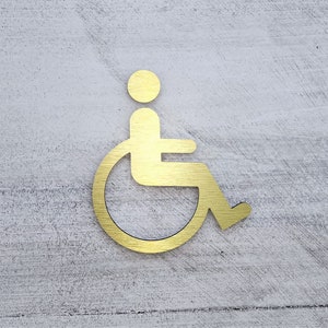 Metal handicap figure. Handicap symbol. Bathroom door sign. Fitting room signs. Business signage.