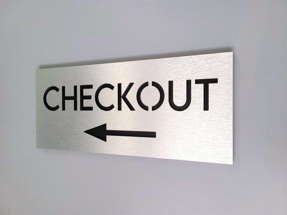 Checkout sign with arrow. Check out this way sign. Directional signs. Wayfinding signs.