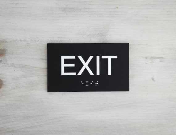 Exit sign with Grade 2 Braille and Tactile text. ADA compliant Exit signs. ADA EXIT sign.