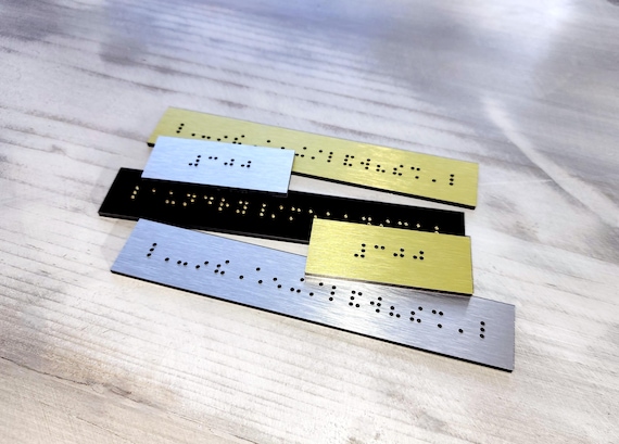 Custom Braille plaques. Braille signs with custom text. Grade 2 domed Braille. Grade 1 Braille labels. Braille strips for existing signs.
