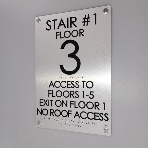 Stairwell floor number signs. ADA and IFC compliant stairwell signs. Floor level number signs with tactile text and Grade 2 Braille.