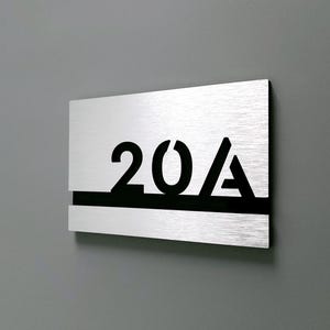 Brushed silver room number signs. Apartment numbers. Hotel room number plates. Custom number signs. Modern address signs. Room numbers.