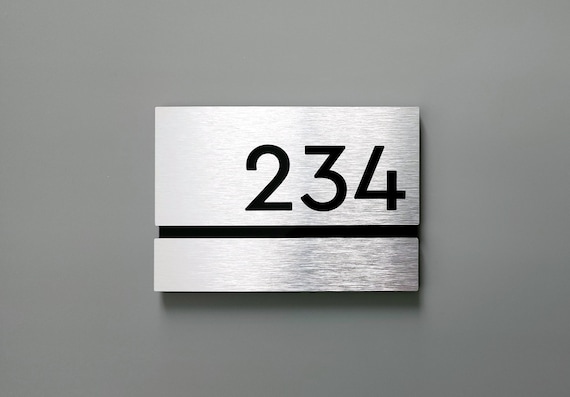 Brushed aluminum number plaque. Silver room numbers. Apartment number signs. Door numbers. Hotel numbers. Modern room number plaques.