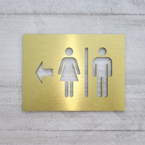 Directional bathroom signs. Restroom sign with arrow. Bathroom direction. Info signs.