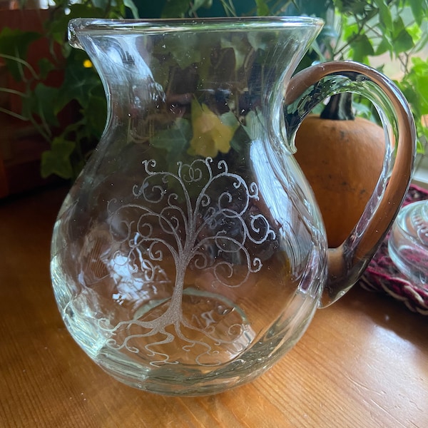 Hand etched glass pitcher