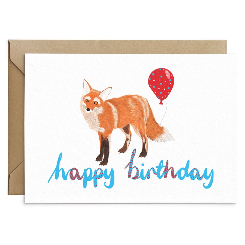 May include: A birthday card with a fox illustration and a red balloon with white polka dots. The card has the text "happy birthday" in blue with red and white stripes.