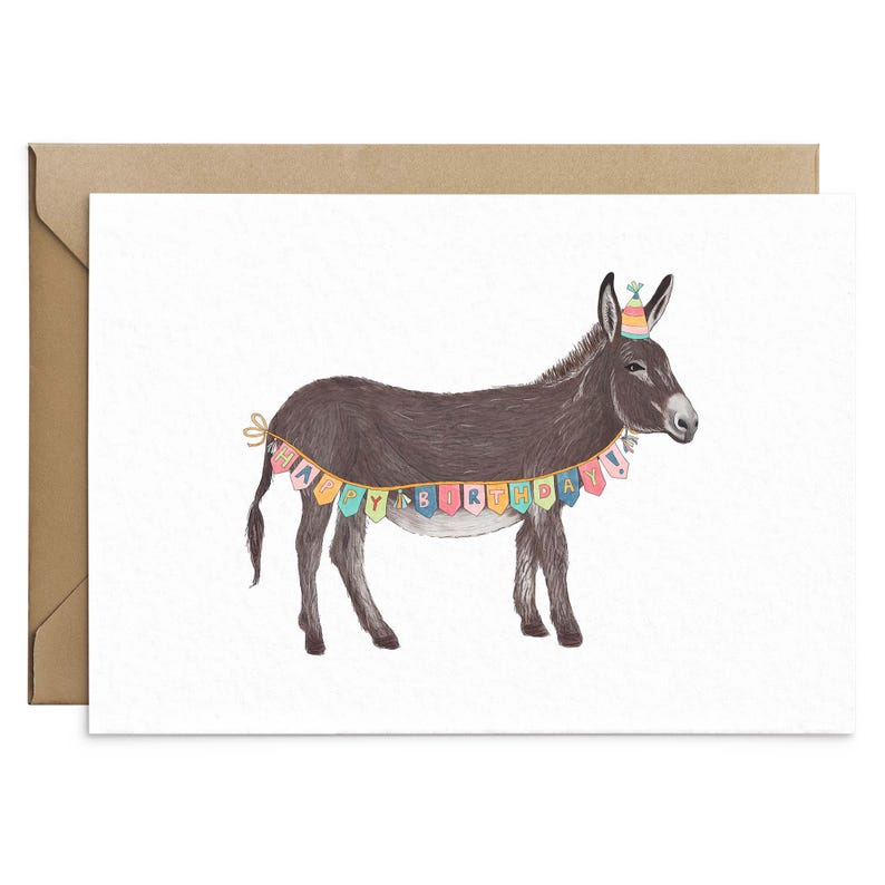 May include: A birthday card featuring a donkey wearing a party hat and a colorful banner that says "Happy Birthday".