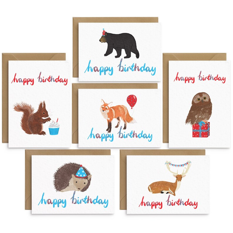 May include: Set of six greeting cards featuring woodland animals with birthday hats and the text "happy birthday". The animals include a bear, fox, owl, squirrel, hedgehog, and deer.