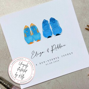 May include: A white card with a blue and orange illustration of two running shoes. The card has the text "Eliza & Robbie" and "A RUN-DERFUL COUPLE 01.08.2024". A pink circle with the text "Uniquely illustrated by Kelly" is in the bottom left corner.