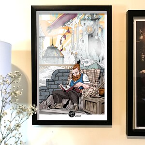 May include: A framed illustration of a man with a beard sitting on a brick wall and reading a book. The background features a whimsical cityscape with a blimp in the sky. The illustration is signed "Jagell Art 2015".