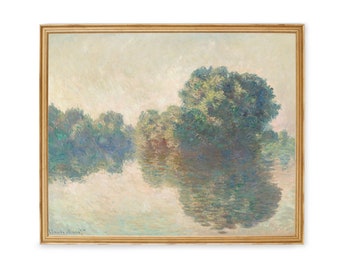 May include: A framed landscape painting depicting a tranquil river scene. The artwork features a gold-colored frame and showcases trees reflected in the water. The color palette includes greens, blues, and soft earth tones, creating a serene atmosphere.